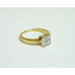 An 18ct gold four stone princess cut diamond square cluster ring