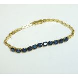 A Continental gold bracelet, with eleven oval mixed cut sapphires, claw set between sections of