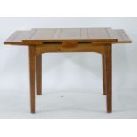 An African draw-leaf dining table, Frank Murphy design, made by Douglas Boyd