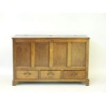 An antique oak dower chest, with three base drawers, 137cm wide