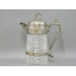A Victorian silver plated and cut glass jug, the cast mount with grapes, naturalistic handles and
