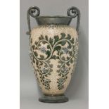 A Doulton Lambeth stoneware vase, by George Tinworth, with twin strap handles, over a raised