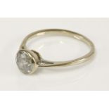 An 18ct white gold single stone diamond ring, estimated as approximately 1.00ct, in a rub over