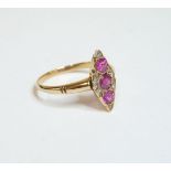 A ruby and diamond marquise shaped cluster ring, finger size M