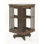 An Edwardian strung, crossbanded and inlaid mahogany revolving bookcase, 88cm high