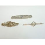 A cased seed pearl and diamond gold bar brooch, faced with platinum, an American Art Deco sapphire