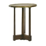 A brass and oak side table, the twelve sided top with a hatched surface and square headed bosses