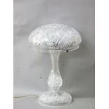A cut glass mushroom lamp, circa 1920, cut glass stem and the dome glass shade resting on a