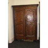 A French oak armoire, with panelled doors, 155cm wide, 213cm high, 52cm deep