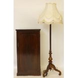 A Victorian mahogany single door cupboard, 56cm wide, 107cm high, and a standard lamp
