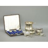 A silver christening tankard, a pair of salts, three silver items, butter knife, jam spoon, and a