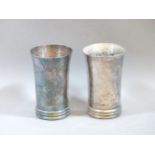 A pair of German silver beakers, with hammered decoration, stamped 925, 12cm high, 8oz