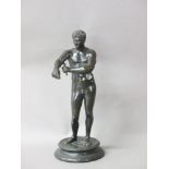 'After the Antique', a bronze figure of a man cleaning after taking the baths, 29cm high