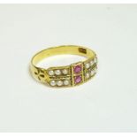 A gold ruby and split pearl half hoop ring, marked 15ct, finger size approximately M-N