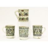 Four mugs, circa 1800, each decorated with bands of stylised flowers and foliage between