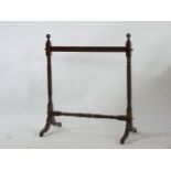 A 19th century mahogany carpet stand, on twist turned supports, 121cm high