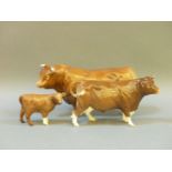 A Beswick 1998 Limousin bull, cow and calf