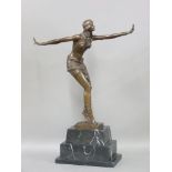 A reproduction bronze of an Art Deco dancing figure, with outstretched arms, on marble base