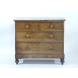 A Victorian mahogany chest of two short and two long drawers, on turned legs, 130cm wide