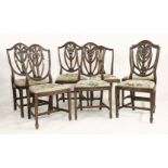 Six Hepplewhite style mahogany single dining chairs, with shield shaped backs and drop-in seats,