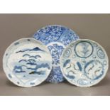 A pair of Oriental blue and white plates, 31cm, and a wall plate, 39.5cm
