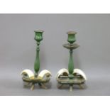 A pair of early 20th century green enamelled candlesticks, with boar's tooth(?) decoration, 19cm