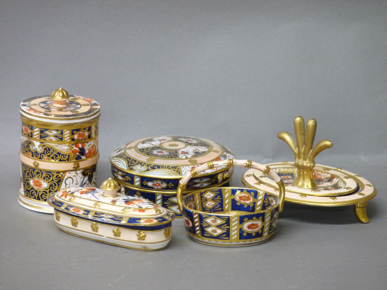 A davenport dressing table box and cover, a ring tree, a pin tray, an oval box and cover, a