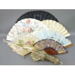 A collection of fans, including two with bone sticks and painted silk leaves, 32 x 30cm long, five