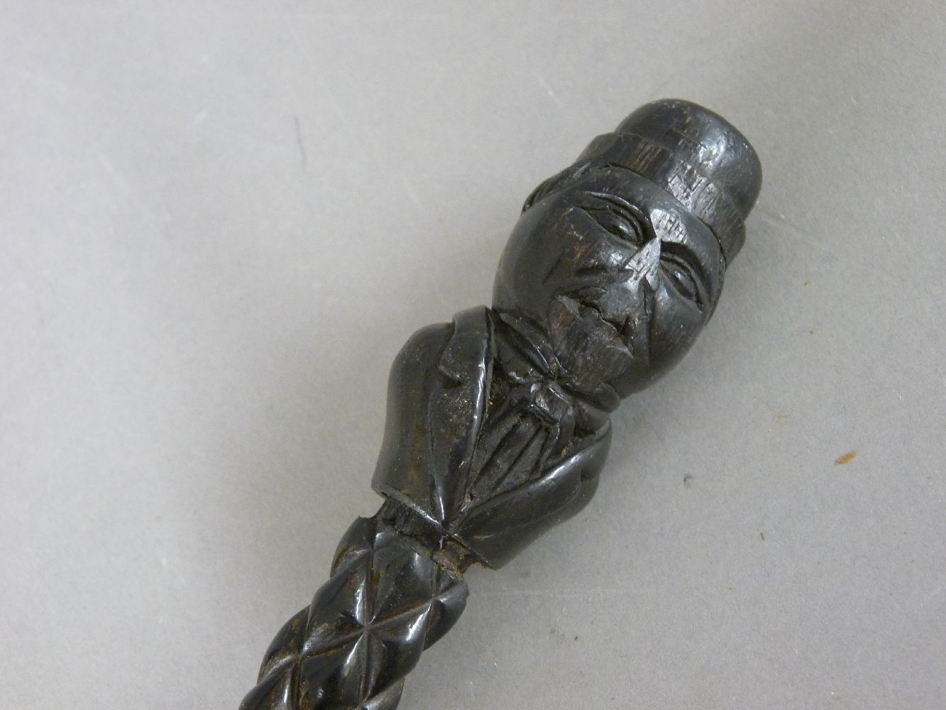An antique tribal walking stick, with a figural head teminal handle, with geometric and spiral twist - Image 2 of 2