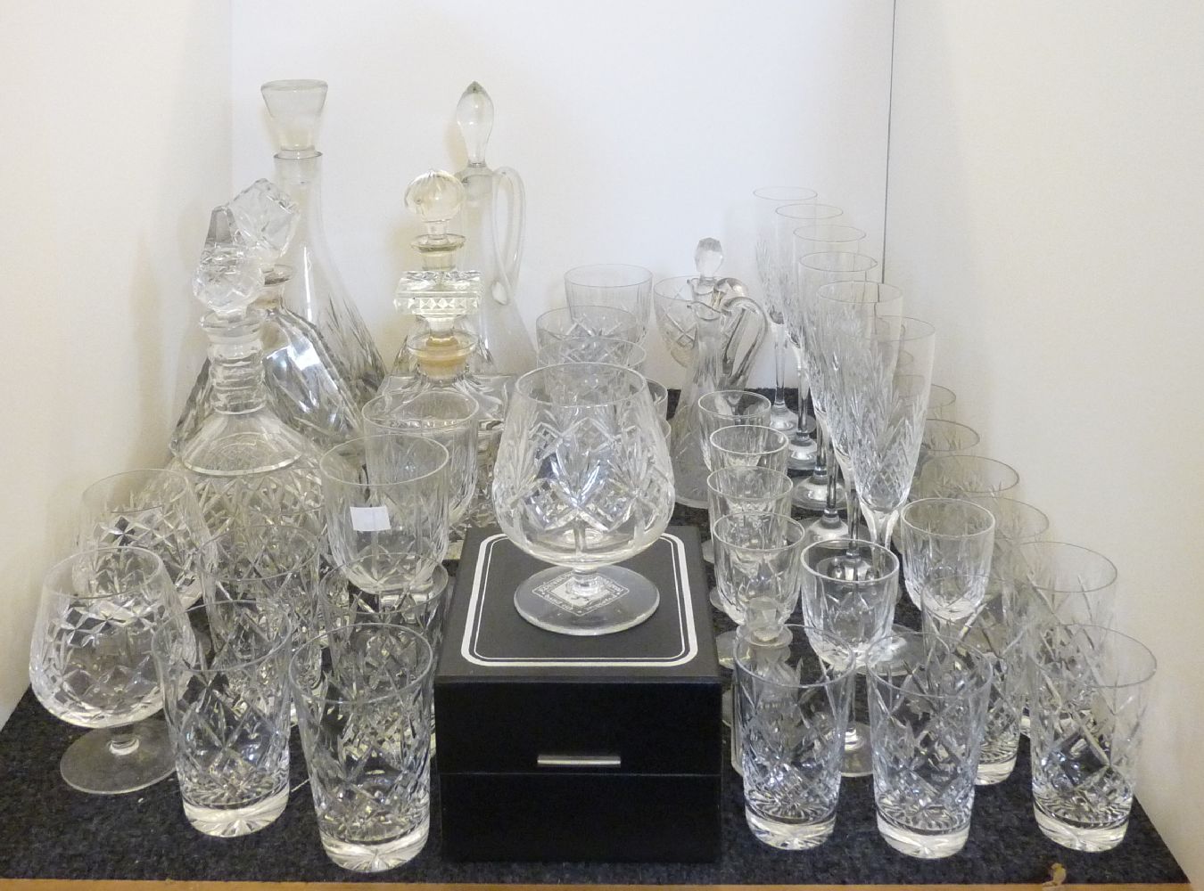 A quantity of cut glass decanters, and drinking glasses