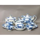 A child's 'opaque granite china' part teaset, by W B & Co, decorated in a blue floral pattern,