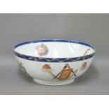 A Chinese export masonic bowl, centred with icons, the blue border with vines, and the exterior with