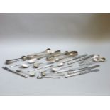 Five pairs of Georgian and later silver sugar tongs, eight condiment spoons, and further items,