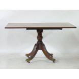 A Georgian mahogany supper table, with a reeded edge over a shaped stand, 98 x 132cm