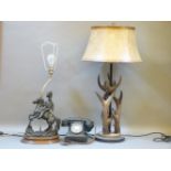 A faux antler table lamp, another lamp, the base modelled as a Hussar, and a telephone