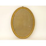 A 18th century oval wall mirror, with a moulded gilt frame, 59 x 43cm