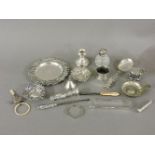 A quantity of silver items, to include a pin dish, napkin rings, cruet items, etc