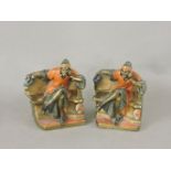 A pair of painted plaster bookends, Dante seated holding a book, thinking, 16cm high