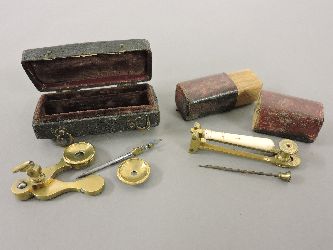 Two early 19th century brass travelling botanist instruments, one in shagreen case with plush