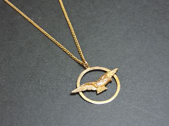 A gold bird pendant, on a gold chain, pendant marked 9ct