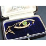 An Edwardian gold and split pearl brooch, marked 15ct