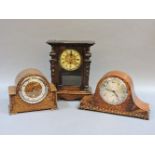 A late Victorian walnut thirty hour mantel clock, and two oak mantel clocks