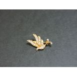 An 18ct gold diamond set bird brooch