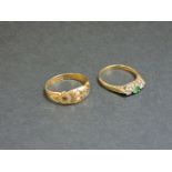 A 9ct gold three stone emerald and diamond ring, and a 15ct gold split pearl, diamond and sapphire