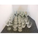 Eight cut glass hock goblets, with coloured stems, and further assorted drinking glasses