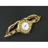 A ladies 18ct gold mechanical bracelet watch