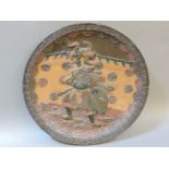 An Oriental earthenware wall plaque, depicting an actor and a devil
