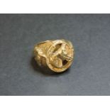 A 9ct gold horseshoe ring, with relief horse heads, 64.5g approximately