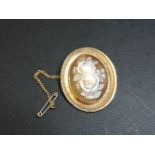 A 9ct gold carved roses shell cameo brooch