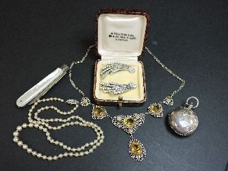 A sterling silver sovereign case, a Continental silver filigree necklace marked 800, a sterling